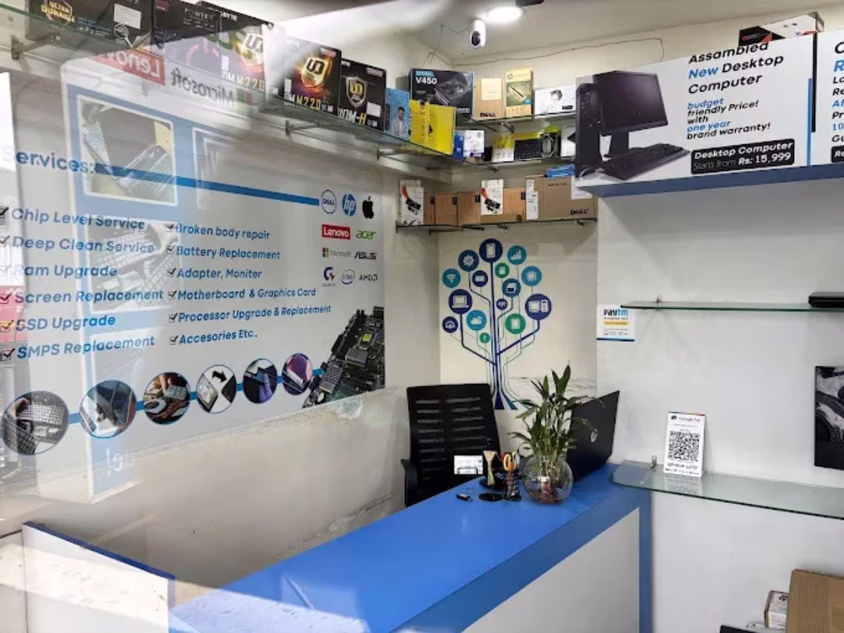 Laptop and desktop service counter with machines waiting for inspection at Laptech Perumbakkam